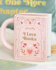 Taza rosa en forma de libro