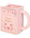 Taza rosa en forma de libro