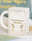 Taza blanca en forma de libro