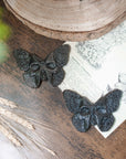 Mariposa/calavera de obsidiana plateada