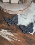 Mariposa/calavera de obsidiana plateada