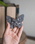 Mariposa/calavera de obsidiana plateada