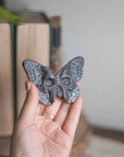 Mariposa/calavera de obsidiana plateada