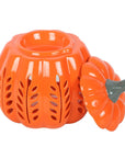 Quemador de aceite y ceras en forma de calabaza naranja