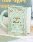 Taza verde en forma de libro