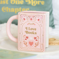Taza rosa en forma de libro