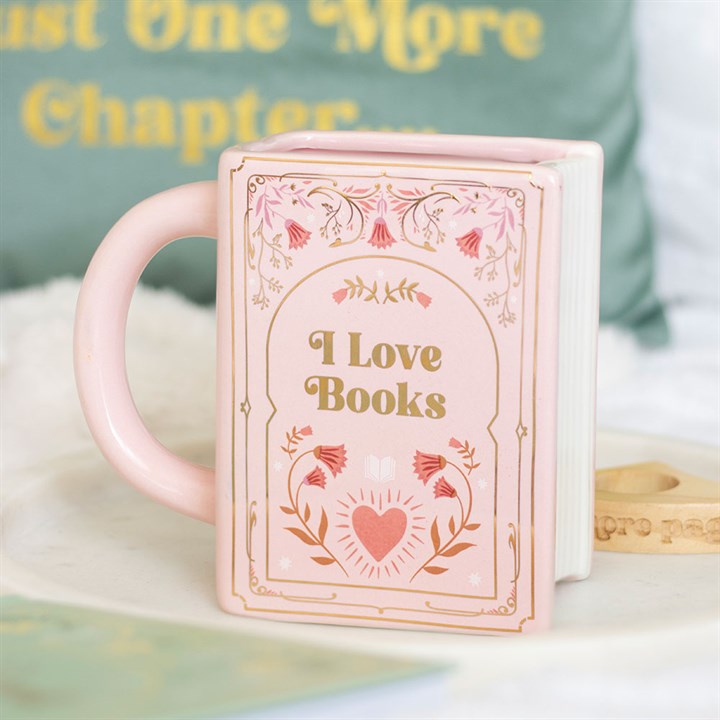 Taza rosa en forma de libro