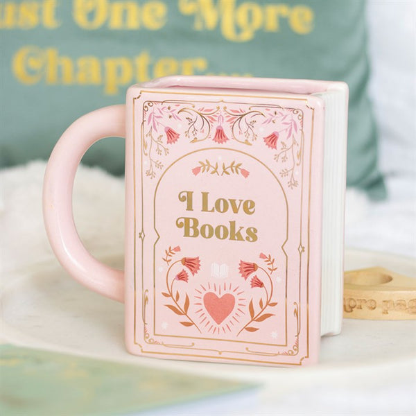 Taza rosa en forma de libro