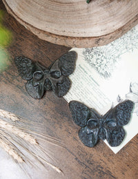 Mariposa/calavera de obsidiana plateada