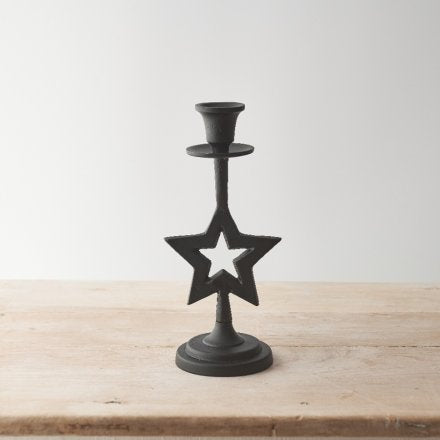 Candelabro de metal con estrella