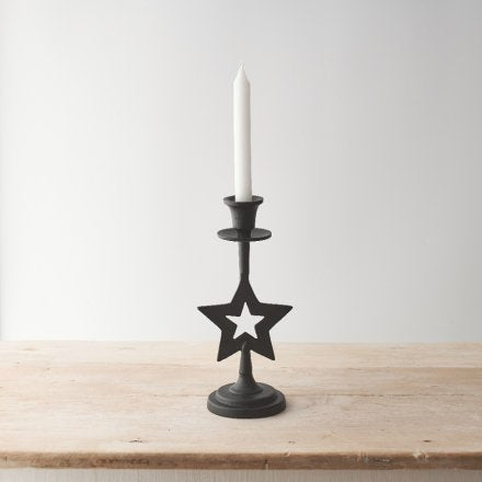 Candelabro de metal con estrella